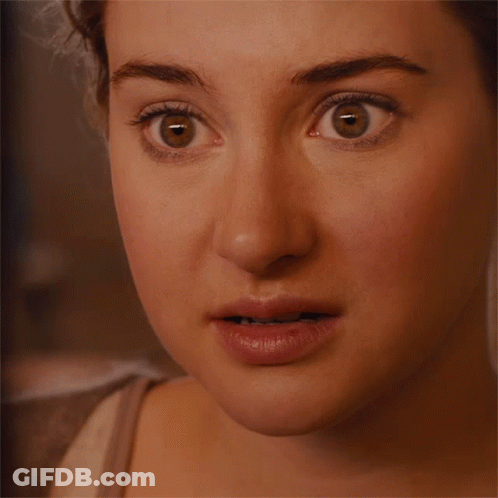 A Close Up Of A Woman 'S Face With A Surprised Expression GIF