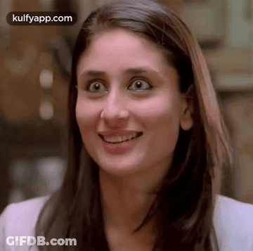 A Close Up Of A Woman 'S Face With A Surprised Expression On Her Face . GIF