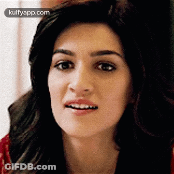 A Close Up Of A Woman 'S Face With A Surprised Expression On Her Face . GIF