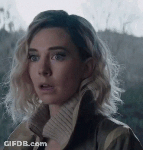 A Close Up Of A Woman 'S Face With A Surprised Expression On Her Face . GIF