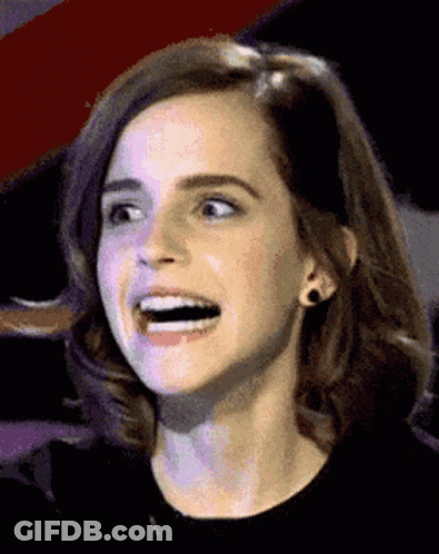 A Close Up Of A Woman 'S Face With A Surprised Look On Her Face GIF