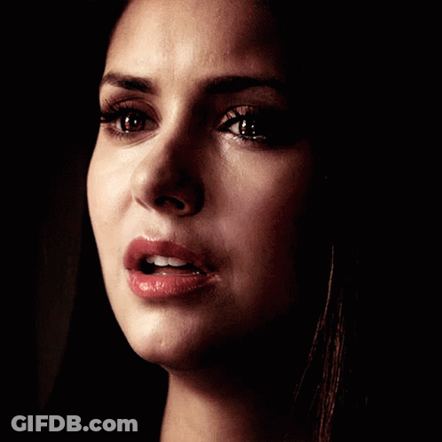 A Close Up Of A Woman 'S Face With A Tear Coming Out Of Her Eye GIF