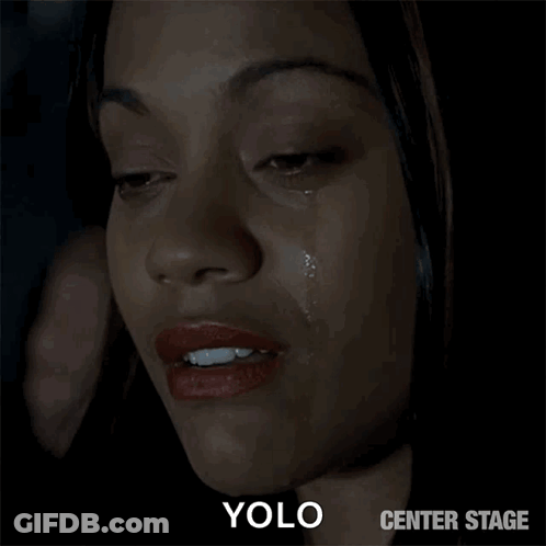 A Close Up Of A Woman 'S Face With A Tear Coming Out Of Her Eye And The Words Yolo Center Stage Below It GIF