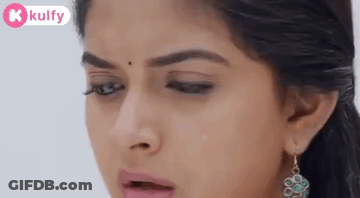 A Close Up Of A Woman 'S Face With A Tear Coming Out Of Her Nose . GIF