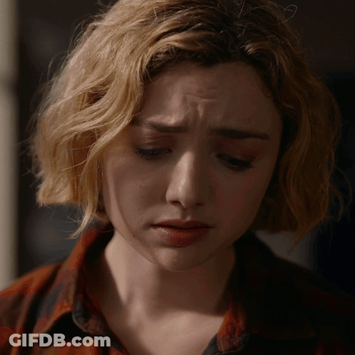 A Close Up Of A Woman 'S Face With A Tear On Her Cheek GIF