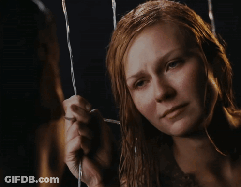 A Close Up Of A Woman 'S Face With A Tear Running Down Her Cheek GIF