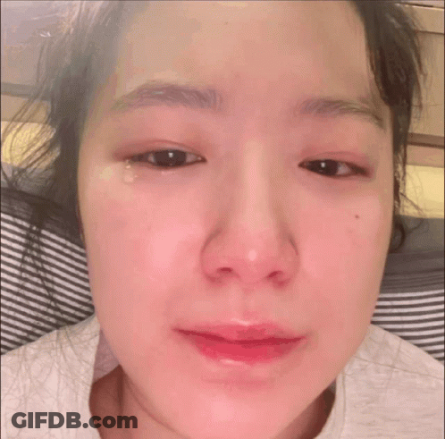 A Close Up Of A Woman 'S Face With A Tear Running Down Her Eye GIF