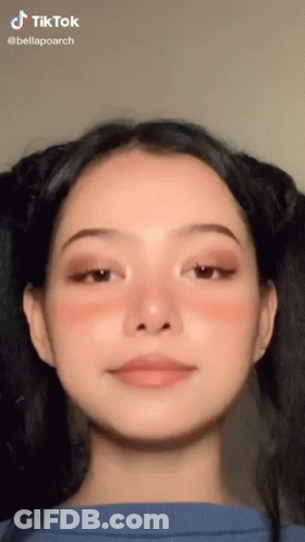 A Close Up Of A Woman 'S Face With A Tik Tok Watermark GIF