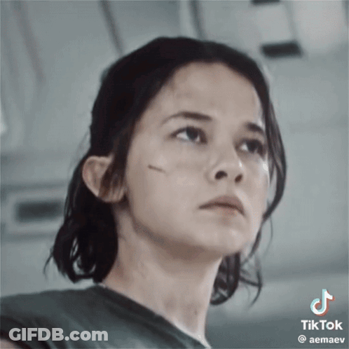 A Close Up Of A Woman 'S Face With A Tik Tok Watermark GIF