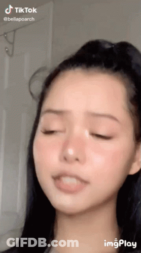 A Close Up Of A Woman 'S Face With A Tik Tok Watermark GIF
