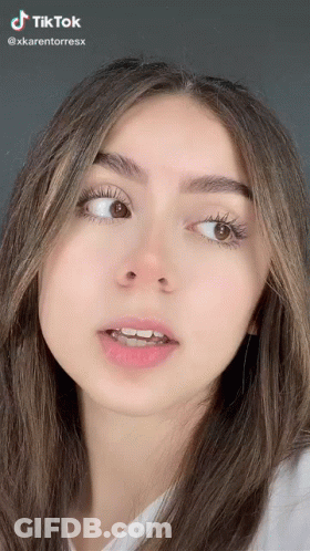 A Close Up Of A Woman 'S Face With A Tik Tok Watermark On It GIF