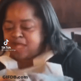 A Close Up Of A Woman 'S Face With A Tiktok Watermark On It . GIF