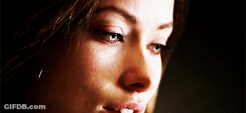 A Close Up Of A Woman 'S Face With A Tooth Missing GIF