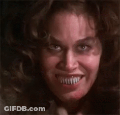 A Close Up Of A Woman 'S Face With A Very Large Smile . GIF