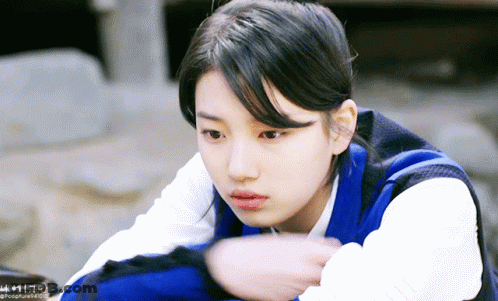 A Close Up Of A Woman 'S Face With A Watermark That Says ' Pocofure ' At The Bottom GIF