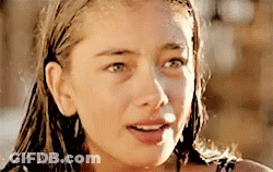 A Close Up Of A Woman 'S Face With A Wet Hair GIF