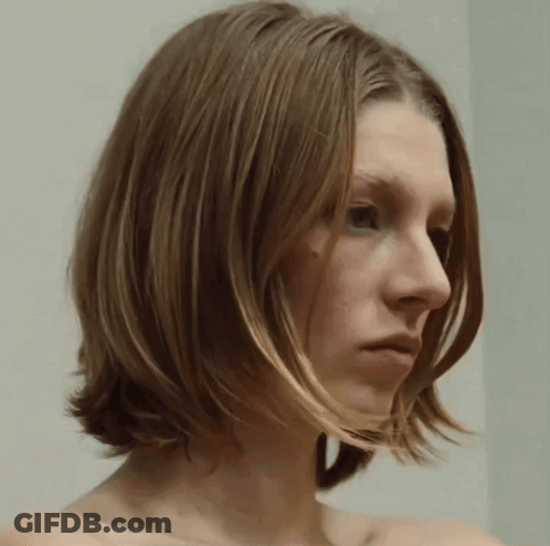 A Close Up Of A Woman 'S Face With A White Background GIF