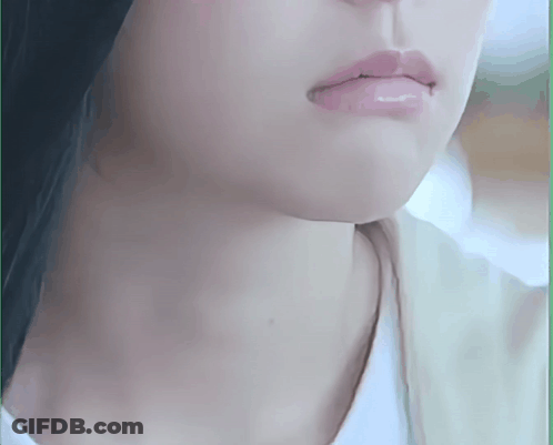 A Close Up Of A Woman 'S Face With A White Shirt On GIF