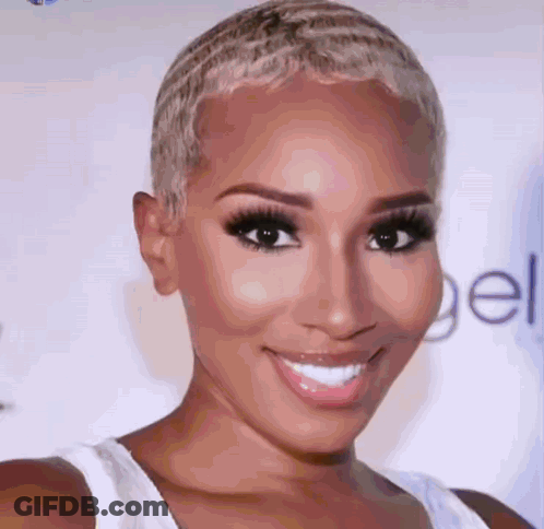 A Close Up Of A Woman 'S Face With A White Tank Top On GIF