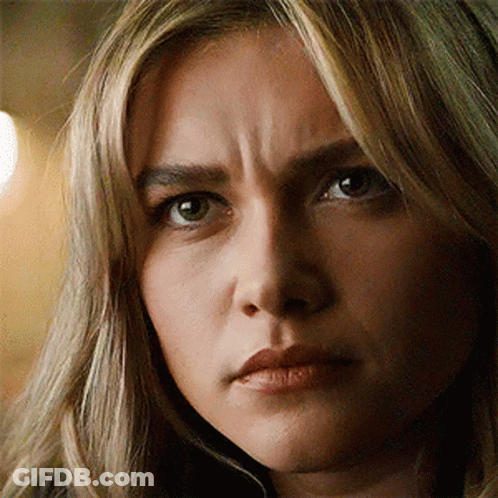 A Close Up Of A Woman 'S Face With A Wrinkle On Her Forehead . GIF