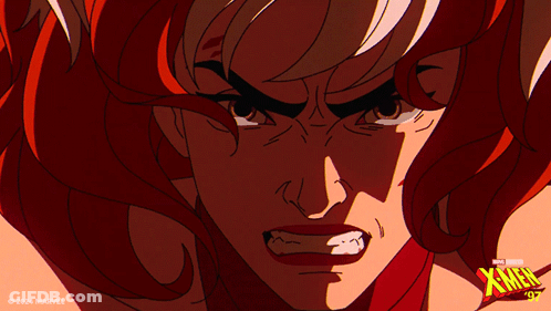 A Close Up Of A Woman 'S Face With A X-Men Logo In The Corner GIF