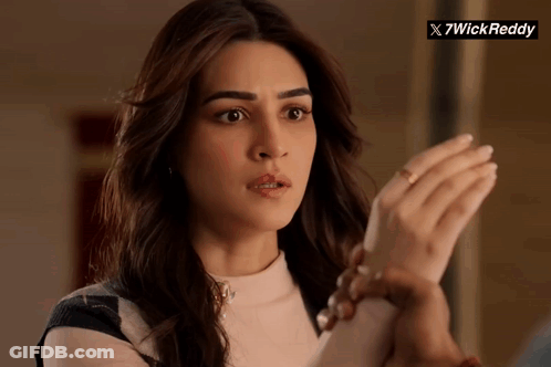 A Close Up Of A Woman 'S Face With A X7wick Reddy Logo In The Background GIF