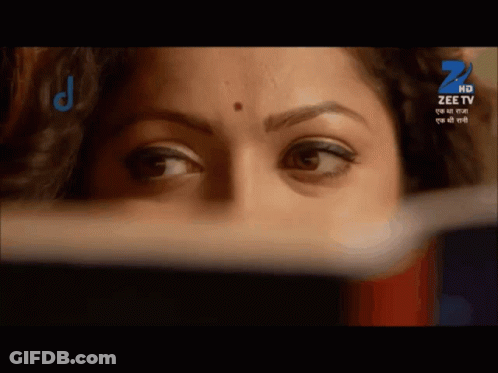 A Close Up Of A Woman 'S Face With A Zee Tv Logo On The Bottom GIF