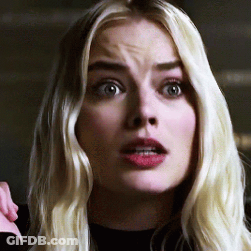 A Close Up Of A Woman 'S Face With Blonde Hair GIF
