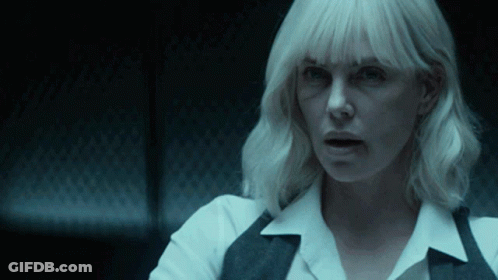 A Close Up Of A Woman 'S Face With Blonde Hair GIF