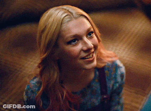 A Close Up Of A Woman 'S Face With Blonde Hair GIF