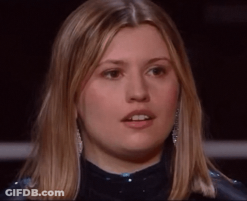 A Close Up Of A Woman 'S Face With Blonde Hair GIF