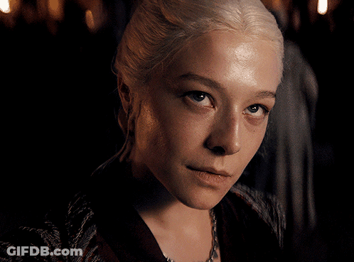 A Close Up Of A Woman 'S Face With Blonde Hair GIF