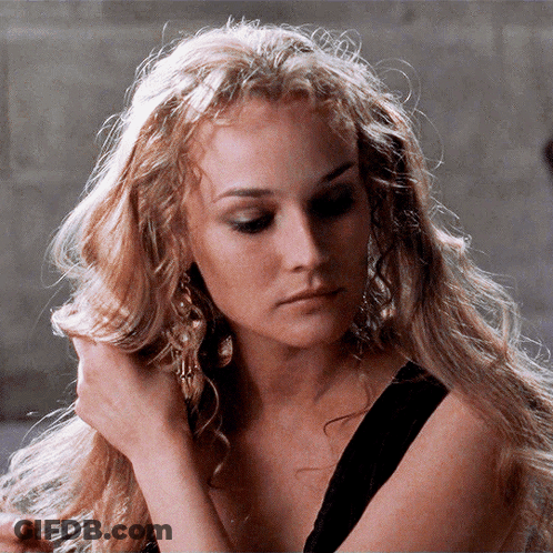 A Close Up Of A Woman 'S Face With Blonde Hair GIF