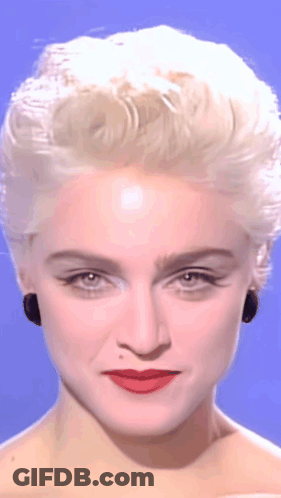 A Close Up Of A Woman 'S Face With Blonde Hair GIF