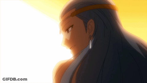 A Close Up Of A Woman 'S Face With Blue Hair And Earrings GIF