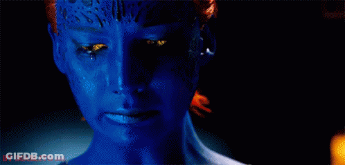 A Close Up Of A Woman 'S Face With Blue Paint On It And A Tear Running Down Her Face . GIF