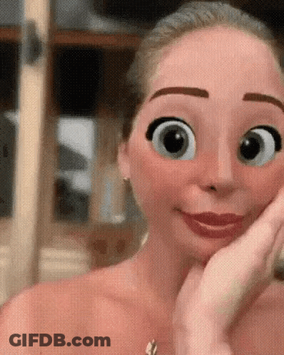 A Close Up Of A Woman 'S Face With Cartoon Eyes GIF