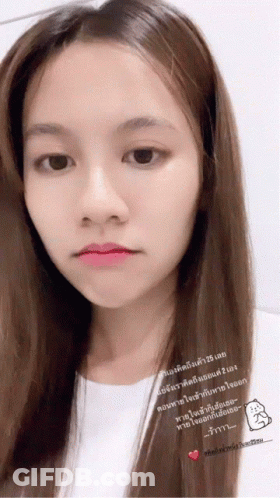 A Close Up Of A Woman 'S Face With Chinese Writing On The Bottom Right GIF