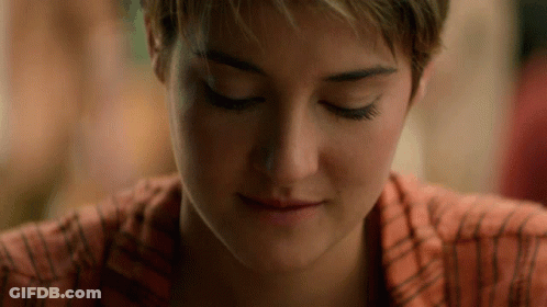 A Close Up Of A Woman 'S Face With Closed Eyes GIF