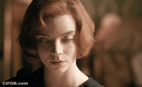 A Close Up Of A Woman 'S Face With Closed Eyes GIF