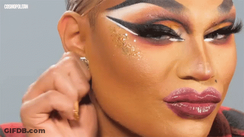A Close Up Of A Woman 'S Face With Cosmopolitan Written On The Bottom Right GIF