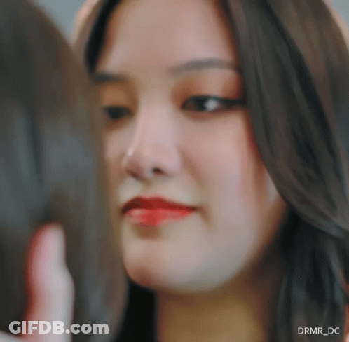 A Close Up Of A Woman 'S Face With Drmr_dc Written In The Corner GIF