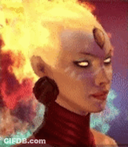 A Close Up Of A Woman 'S Face With Fire In Her Hair . GIF