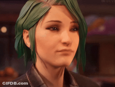 A Close Up Of A Woman 'S Face With Green Hair . GIF