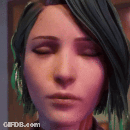 A Close Up Of A Woman 'S Face With Green Hair GIF