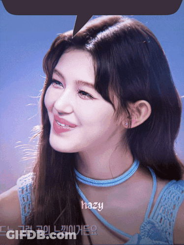 A Close Up Of A Woman 'S Face With Hazy Written Above Her GIF