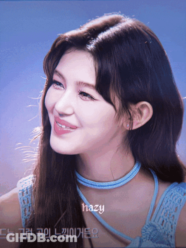 A Close Up Of A Woman 'S Face With Hazy Written On The Bottom Right GIF