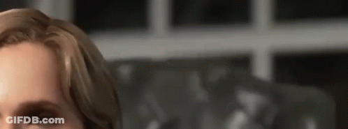 A Close Up Of A Woman 'S Face With Her Eyes Closed . GIF
