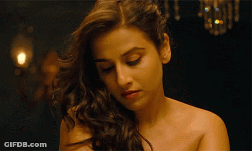 A Close Up Of A Woman 'S Face With Her Eyes Closed GIF