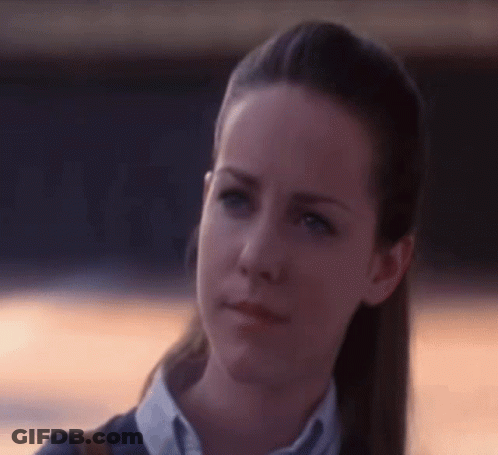 A Close Up Of A Woman 'S Face With Her Eyes Closed GIF
